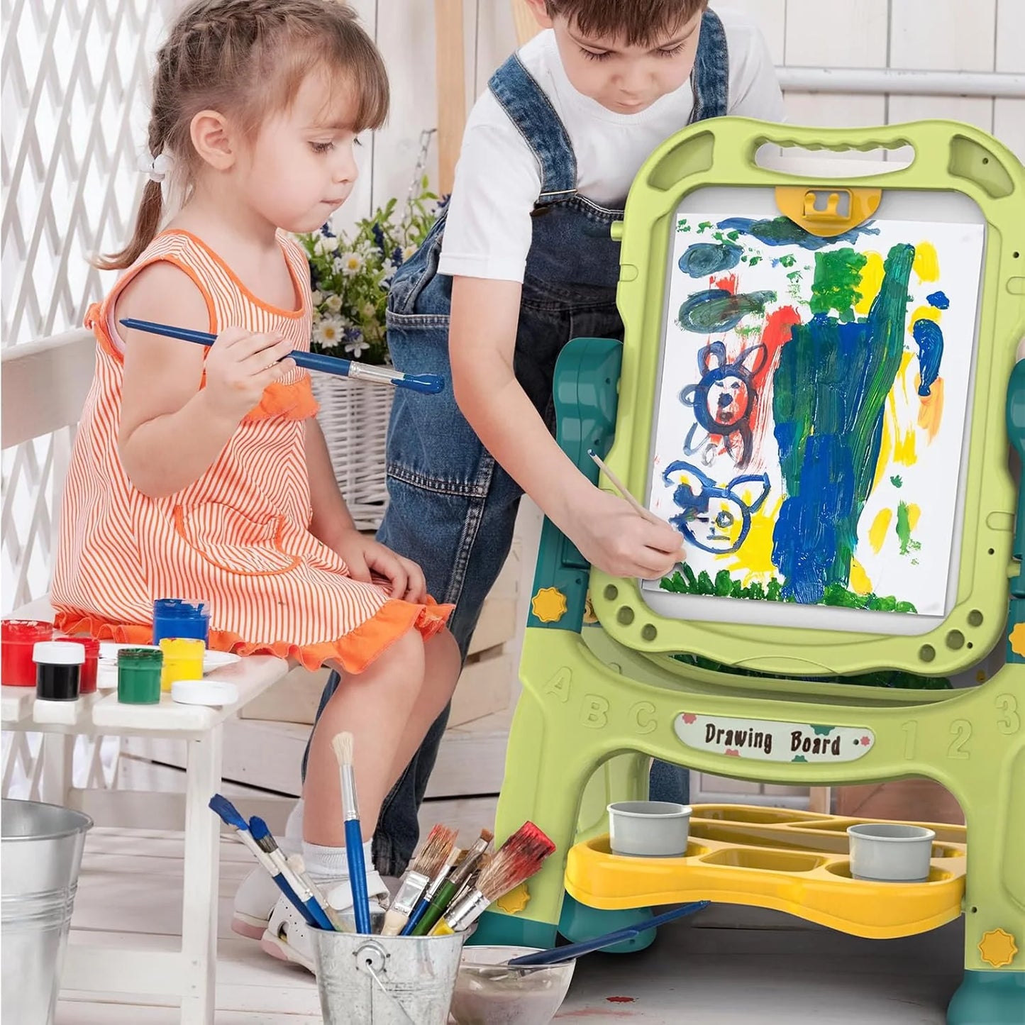 Two children using a green and yellow Learn-n-Draw Double Fun Board with art supplies – 2-in-1 whiteboard and chalkboard for kids