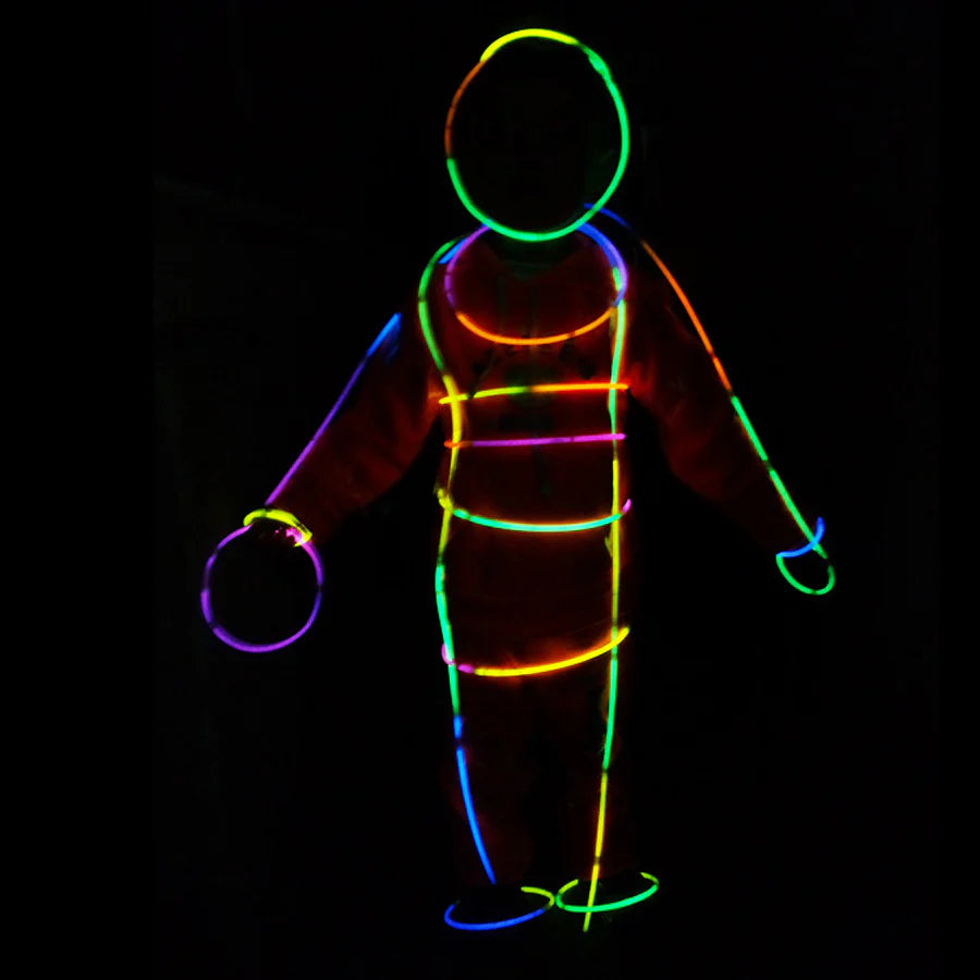 Colorful glowing outline of a person against black background – neon glow sticks effect for kids’ parties
